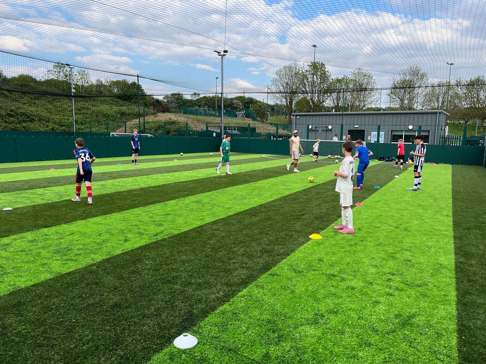 Weekly football coaching session for kids at Power League Arnold, Nottinghamshire